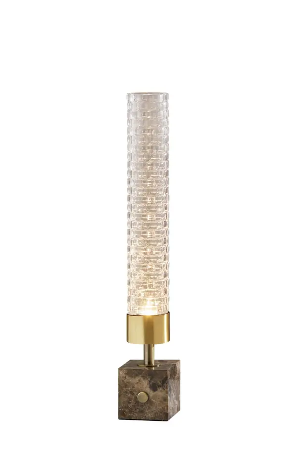 The Harriet LED Table Lantern combines luxurious brown marble with textured glass and antique brass accents for a striking mid-century aesthetic. Energy-efficient LED lighting creates an artistic glow through the carefully cut glass cylinder.