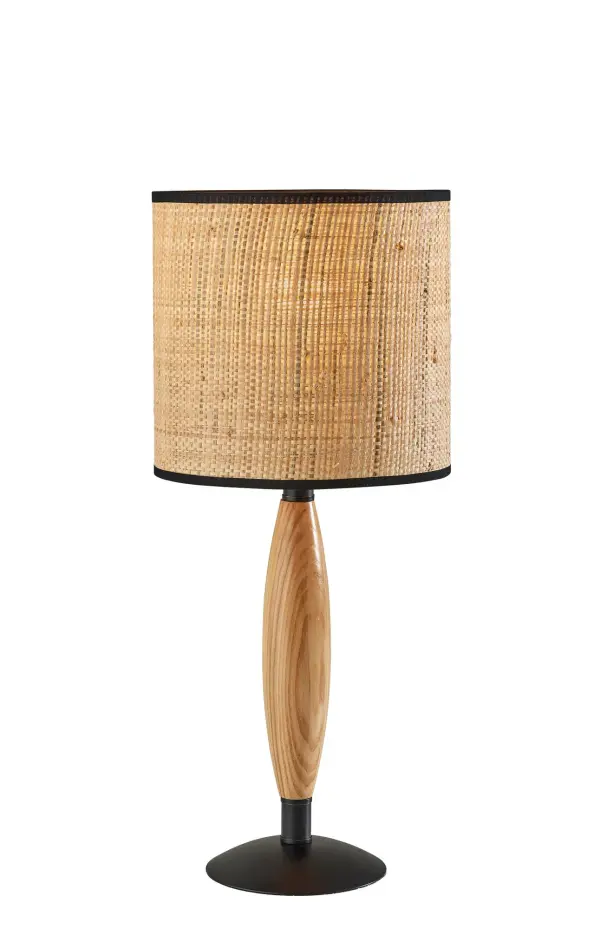 The Cayman table lamp blends natural wood, woven rattan, and black metal accents for a sophisticated coastal aesthetic. At 22.5" tall, it's perfectly sized for bedside tables and desks, offering 3-way lighting control.