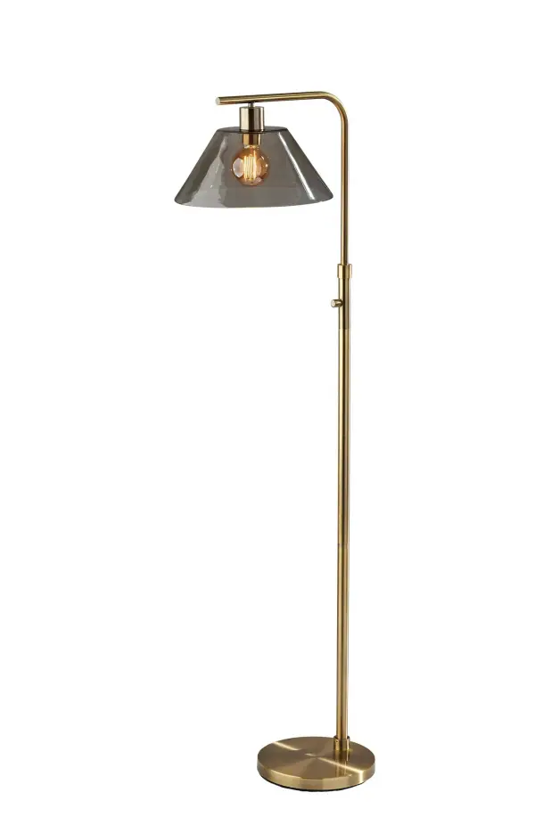 The Zoe floor lamp combines industrial charm with modern functionality. Its antique brass finish and smoked glass shade create ambient lighting perfect for reading nooks or living spaces. The curved arm design adds visual interest while the exposed bulb design allows for vintage Edison bulb styling.