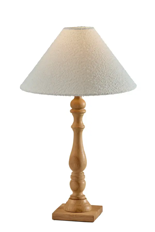The Rigby Table Lamp combines natural rubberwood warmth with a soft white boucle shade for inviting illumination. Its 3-way switch offers flexible brightness control, while the timeless design complements both traditional and contemporary spaces.