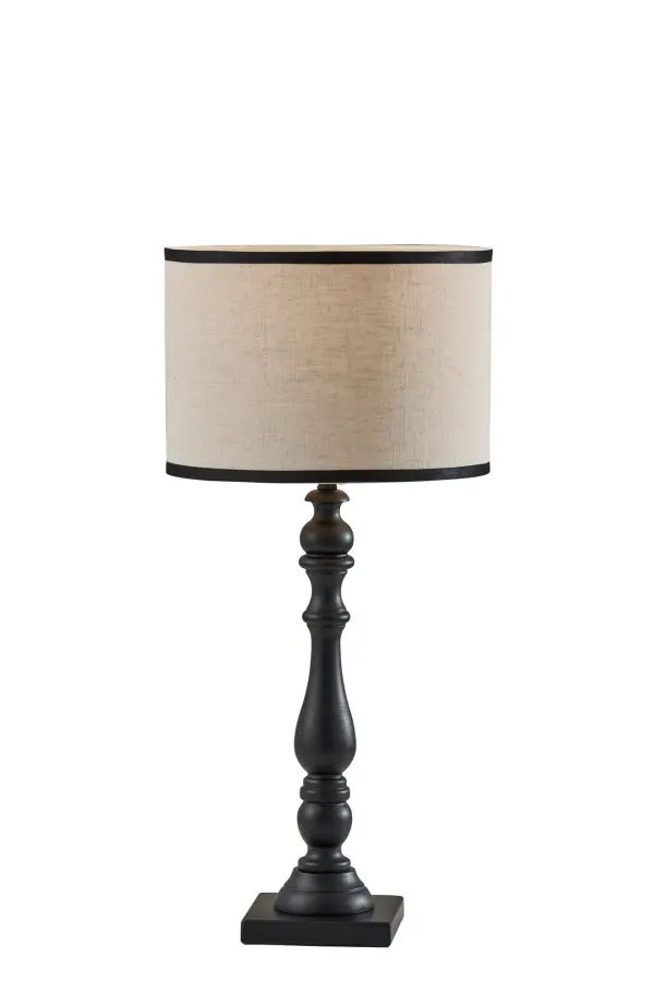 The Zeek Table Lamp combines a turned black rubberwood base with a cream textured fabric shade for sophisticated style. Its 3-way switch offers flexible lighting control, making it perfect for bedrooms, living spaces, and offices.