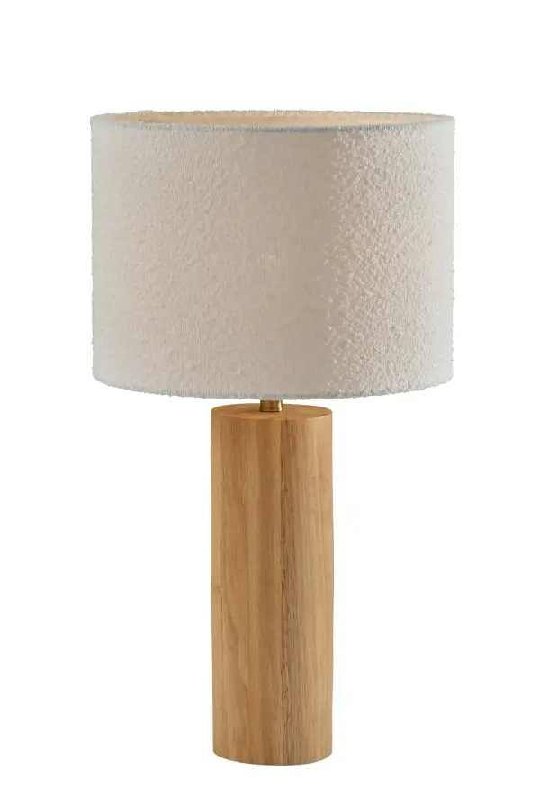 The Brayden Table Lamp combines natural rubberwood with soft boucle fabric to create warm, inviting illumination. Its 28-inch height and 3-way switch offer versatile lighting control for any space.
