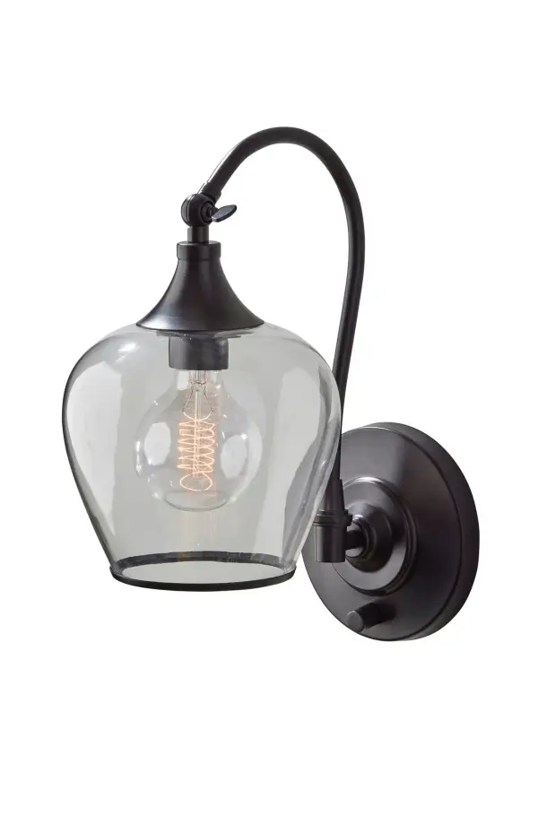 The Bradford Wall Lamp combines industrial style with practical functionality. Its pivoting tulip glass shade and included vintage Edison bulb create warm, adjustable lighting perfect for bedrooms, living spaces, and offices.