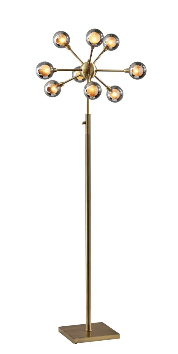 The Starling LED Floor Lamp delivers dramatic mid-century modern style with nine globe-shaped smoked glass shades extending from a central brass sphere. Energy-efficient integrated LEDs and full-range dimming make it both beautiful and practical.