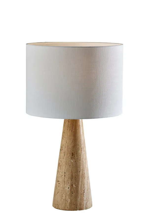 The Travis Tall Table Lamp combines luxurious travertine stone with modern design sensibility. At 25.5 inches tall, it makes a commanding statement while the white textured fabric shade provides soft, inviting illumination.