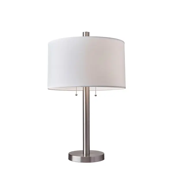 The Boulevard table lamp combines brushed steel construction with a white fabric drum shade for versatile modern style. Dual pull-chain switches offer flexible lighting control with two 100W bulbs for bright task lighting or ambient glow.