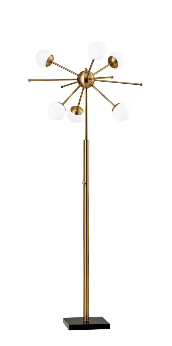 The Doppler LED Floor Lamp delivers eye-catching mid-century modern style with six clustered opal glass globes creating a beautiful burst of light. The antique brass finish and black marble base add sophistication to any space.