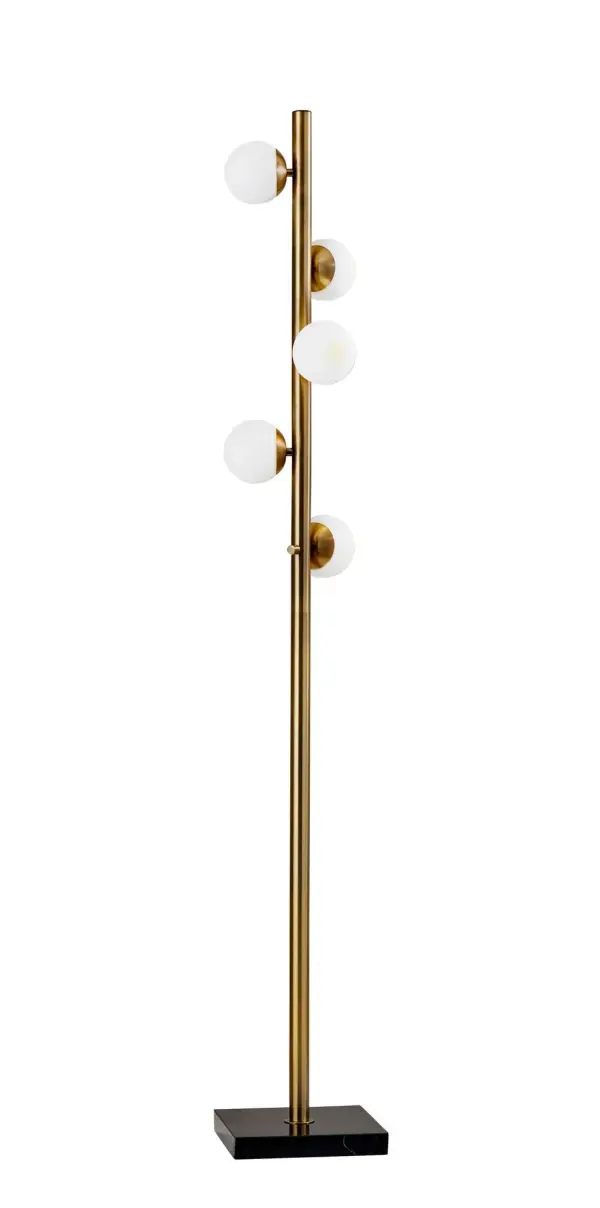 The Doppler LED Tree Lamp brings mid-century modern elegance with five white opal glass globes scattered along an antique brass pole. The black marble base adds sophistication while providing stability. Includes energy-efficient LED bulbs.