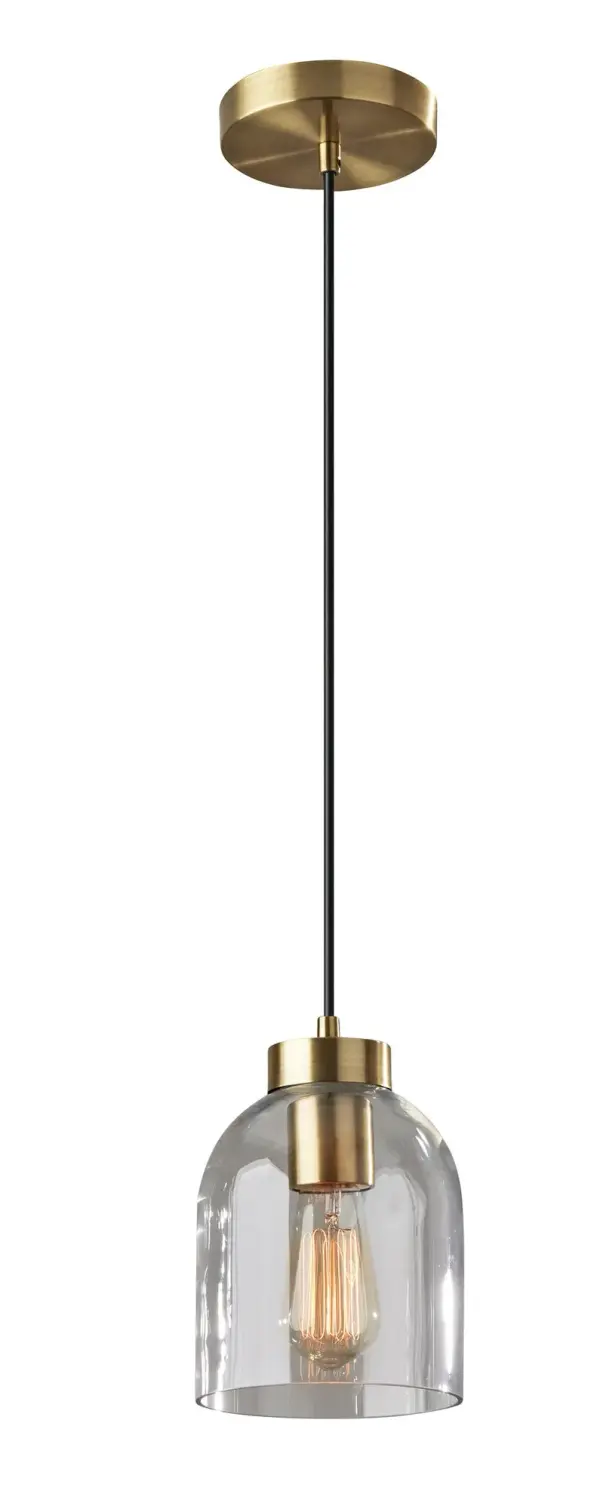 The Bristol Pendant combines timeless mid-century modern design with industrial flair. Its clear glass dome shade showcases a vintage Edison bulb, while the antique brass finish adds warmth. Perfect for layering multiples over islands or dining tables.