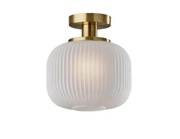 The Hazel flush mount combines mid-century elegance with practical functionality. Its frosted ribbed glass shade and antique brass finish create a sophisticated ambient glow perfect for moisture-prone areas.