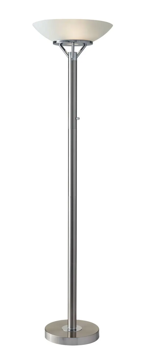 The Expo Floor Lamp delivers exceptional ambient lighting with its patented 300W double socket construction, providing 3x more light than typical torchieres. Brushed steel finish with chrome accents and frosted glass shade create a bold, contemporary presence.