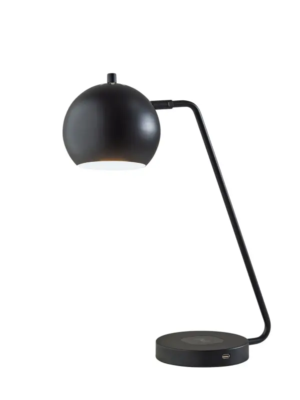 The Emerson desk lamp combines sleek contemporary design with smart functionality. Features a 6.5" adjustable globe shade, built-in Qi wireless charging pad, and USB outlet for multi-device charging. Perfect for modern workspaces.