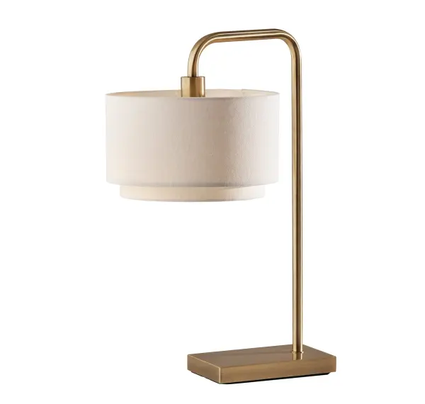 The Brinkley Table Lamp combines timeless brass elegance with a distinctive two-tiered white fabric drum shade. Its classic transitional design works beautifully across traditional and contemporary interiors, offering warm, diffused lighting with convenient rotary switch control.