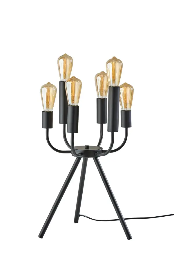 The Rory table lamp reimagines the classic candelabra with modern industrial flair. Six upward-curving arms create a striking sculptural silhouette, while the black metal construction and exposed bulb design make a bold statement in contemporary interiors.