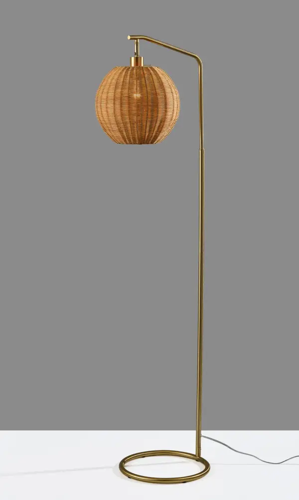 The Maeve Floor Lamp combines antique brass sophistication with organic rattan texture, creating a perfect transitional piece. At 60 inches tall, it delivers ambient lighting with vintage charm and natural warmth.