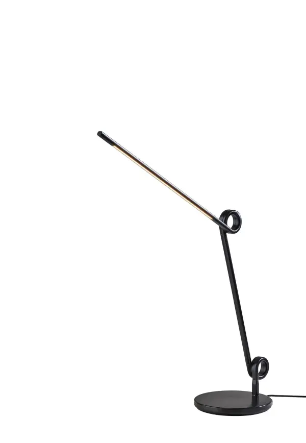 The Knot LED Desk Lamp combines sculptural design with practical functionality. Its articulating arm with decorative knot details allows precise light positioning, while integrated USB and USB-C ports keep devices charged. The 4-way touch dimmer and warm 3000K LED provide customizable task lighting in a sleek monochrome design.