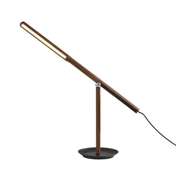 The Gravity LED Desk Lamp combines modern elegance with exceptional functionality. Its innovative magnetic ball joint allows endless adjustability, while the walnut ash wood and black metal design adds sophistication to any workspace.