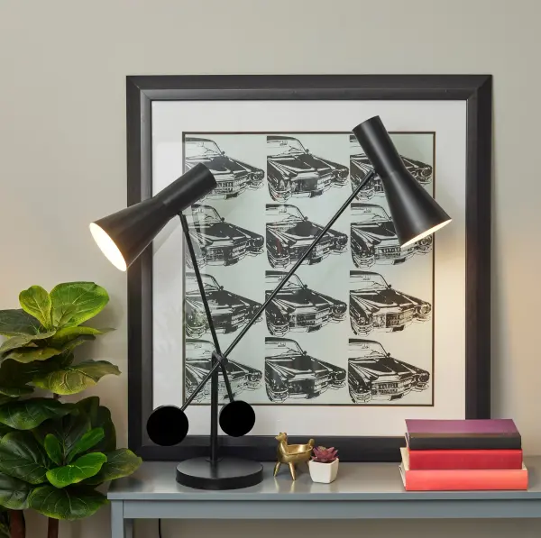 The Bond desk lamp combines artistic industrial design with exceptional functionality. Featuring two adjustable cone shades on articulating stems, this versatile lamp provides customizable task lighting for any workspace while offering convenient USB charging. - alternate view