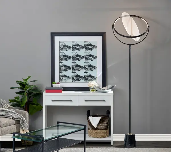 The Orsa LED floor lamp combines artistic design with functional lighting. Its rotating 19.5" disc-shaped LED frame and luxurious marble base create a dramatic statement piece with adjustable illumination for any space. - alternate view