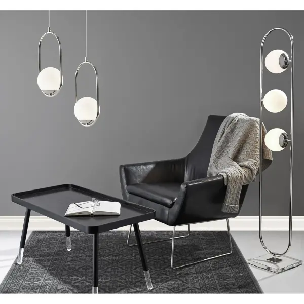 The Kendrick Chair combines contemporary minimalism with industrial edge through its brushed steel legs and distressed black leather upholstery. Spacious seating with 350-lb capacity offers comfort and durability. - alternate view