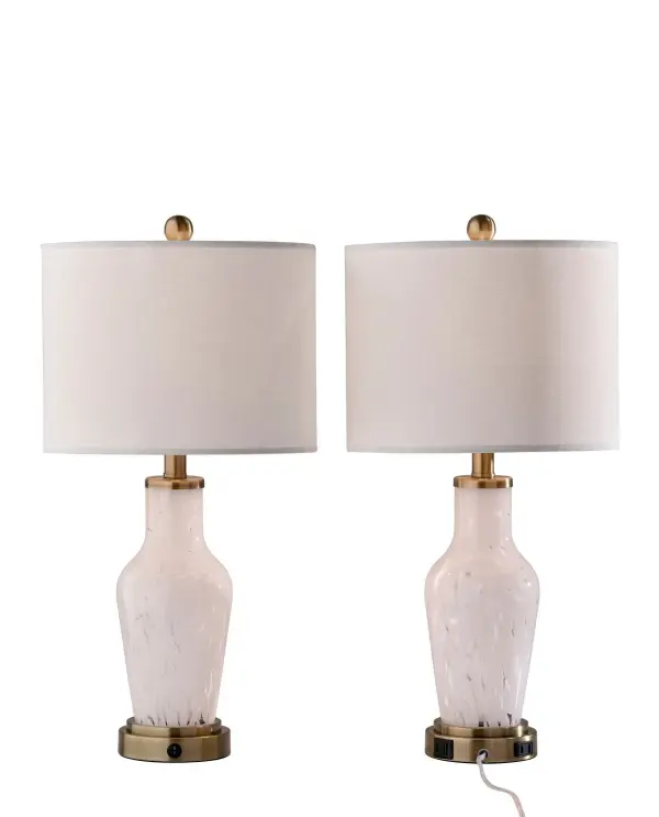 This table lamp set features a softly tapered glass base with a subtle marbled finish and a clean drum shade for an elegant, versatile look. The antique brass-tone accents add warmth, while the white shade keeps the design crisp and easy to style. Built-in USB and AC outlets at the base add everyday convenience. Collection: Grady Finish: White Texture Glass, White Linen, Antique Brass Glass: Linen texture fabric shade Width: 12.00" Height: 23.83" Length: 12.00" Weight: 9.31 lb Extension from Wall: 12.00" Wire: 60" Clear cord Maximum Wattage: 100.00 W Bulb Base: E26 Light Source: Incandescant Material: Glass:40% Fabric:30% Iron:20% Electric:10% Country of Origin: Cambodia Safety Listing: ETL Switch: On/off rotary socket switch, Rocker switch on base to control night light