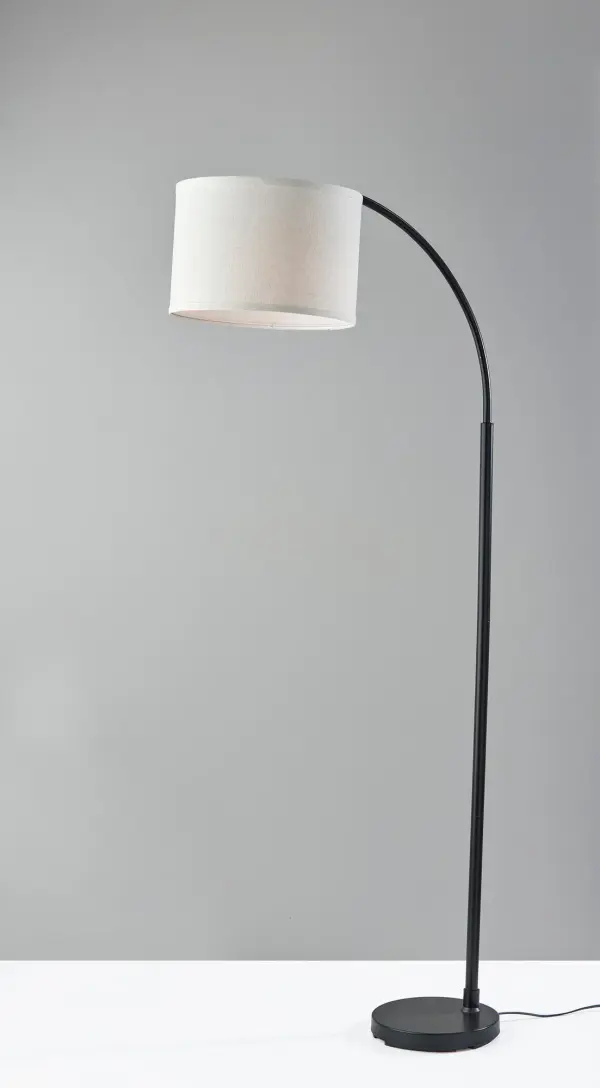 The 64-inch Jace floor lamp combines modern minimalist design with practical functionality. Its arcing silhouette and adjustable shade make it ideal for reading or working, while the sleek black finish complements contemporary interiors. - alternate view