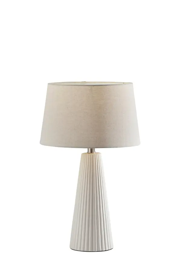 The Lana table lamp set combines modern ceramic craftsmanship with transitional style through its distinctive vertical ribbed texture. The off-white base paired with oatmeal linen drum shades creates a sophisticated neutral palette that complements diverse interiors.