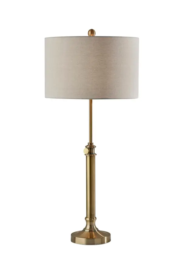 The Barton Table Lamp combines modern farmhouse charm with practical functionality. Its adjustable height feature (26-34.5 inches) and warm antique brass finish make it adaptable to various room settings and furniture heights.
