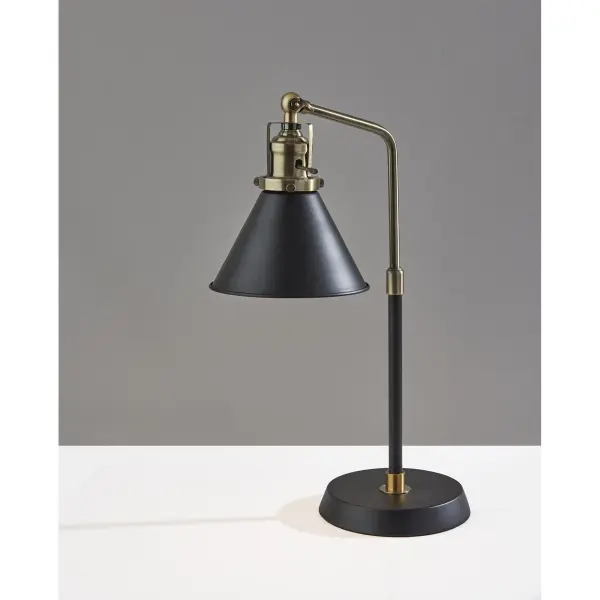 The Arthur Desk Lamp combines industrial charm with modern functionality. Its adjustable shade and compact 19.5" profile make it perfect for small workspaces, while the black and antique brass finish adds sophisticated style. - alternate view