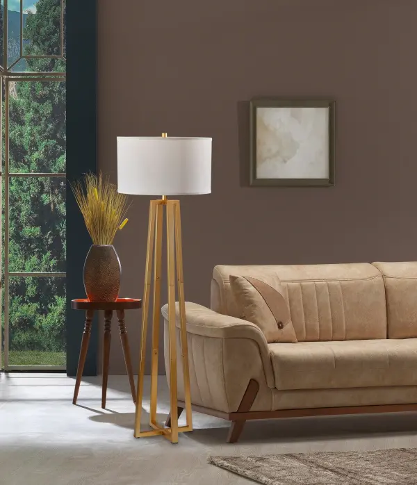 The Oakley Floor Lamp combines timeless brass elegance with practical functionality. Its white linen shade creates warm ambient lighting, while the 3-way switch offers customizable illumination for any occasion. - alternate view