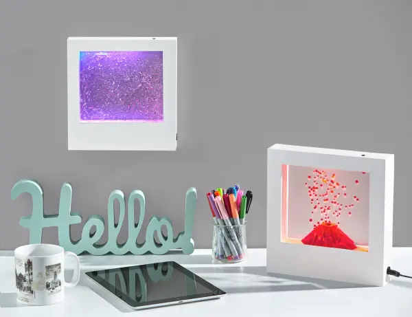 This unique decorative light box features flowing glitter and continuously changing LED colors, perfect for adding personality to dorm rooms, bedrooms, or apartments. Versatile power options include battery or plug-in operation. - alternate view