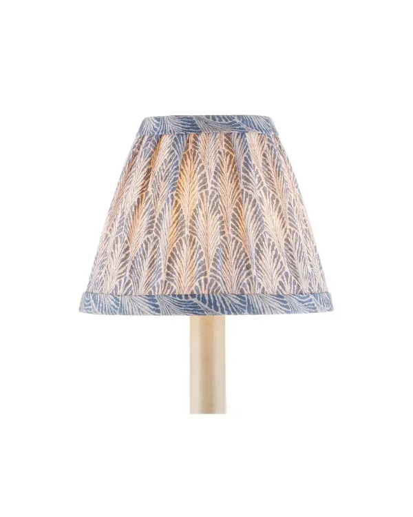 This petite chandelier shade from Lacefield Designs brings coastal charm with its soft blue fan-like pattern on ivory cotton. At 6 inches wide, it's perfectly sized for small fixtures in bedrooms, bathrooms, and closets.