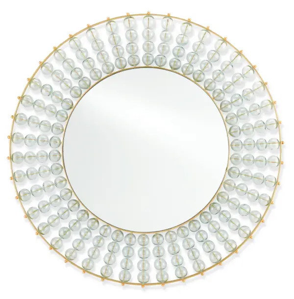 The Calais Mirror showcases intricate open-weave metalwork inspired by French lace-making traditions. Hollow recycled glass balls threaded through gold leaf iron rings create dimensional texture and light-catching brilliance.