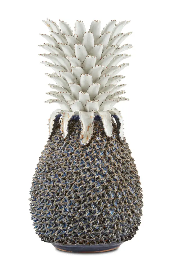 This striking ceramic pineapple sculpture brings coastal charm and artisanal craftsmanship to any space. Handmade by women artisans, the powdery blue and white finish creates a sophisticated take on the classic hospitality symbol.