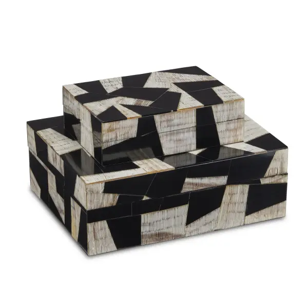 These handcrafted decorative boxes blend natural buffalo horn with black composite in a striking modernist design. The chiseled horn texture adds organic depth, while linen-lined interiors and felt bottoms showcase fine craftsmanship.