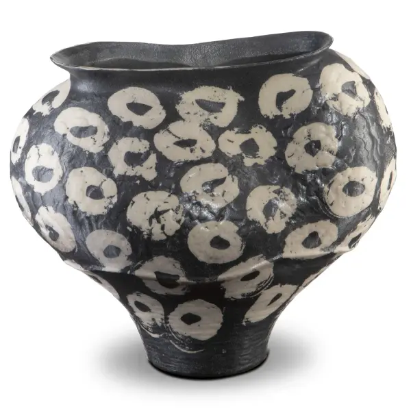 A studio-crafted porcelain bowl featuring asymmetrical form and hand-painted swirling brushstrokes. Each piece is unique with variations in darkness and brush patterns, making it a distinctive decorative accent.