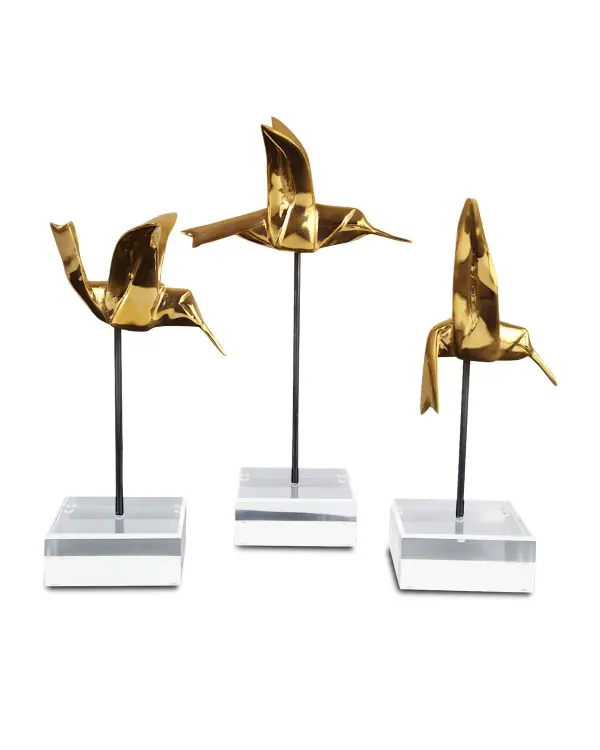 Three beautifully crafted bronze hummingbirds with gold polish finish create the illusion of folded paper origami. Mounted on sleek black rods with clear acrylic bases, these sculptures capture birds in graceful flight stages.