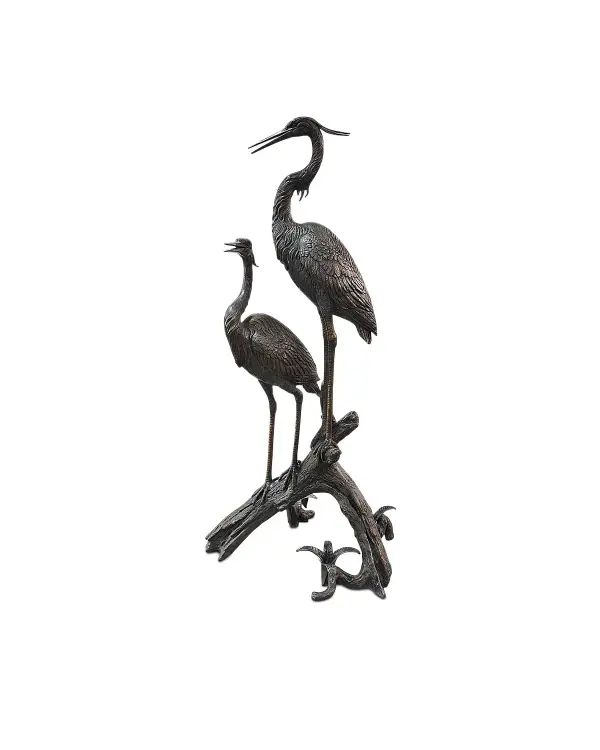 This impressive 68-inch bronze sculpture captures two herons perched on driftwood with extraordinary realism. Hand-crafted in Thailand, every feather plume and leg detail is meticulously rendered, creating a statement piece that bridges fine art and functional décor.