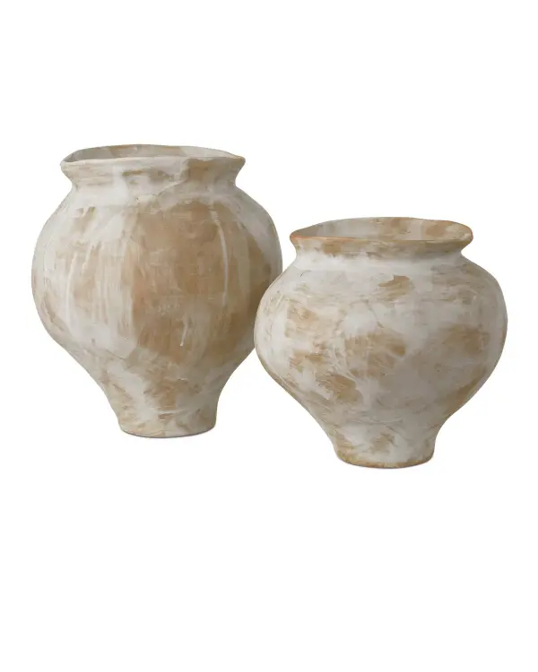 This set of two hand-thrown porcelain vases showcases visible brushstrokes and organic shapes that bring gallery-worthy artistry to any space. The antique white and light brown glazing creates a sophisticated neutral palette.