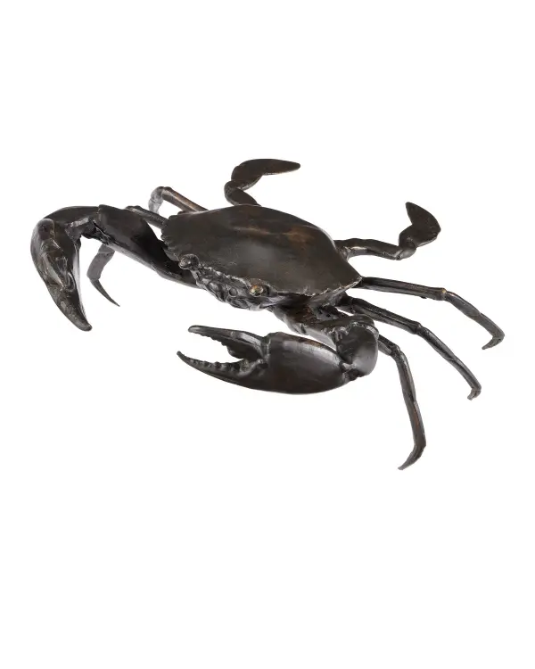 This handcrafted bronze crab sculpture showcases exceptional attention to detail with its dark brown patina finish. The artisan-applied surface treatment creates authentic textural aging that makes this piece both a playful accent and sophisticated conversation starter.