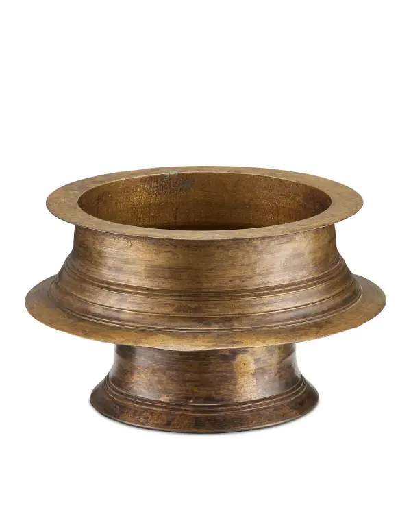 This decorative bowl brings authentic artisanal character to any space with its antique brass finish and traditional Indian vessel design. At under 10 inches wide, it's perfectly sized for console tables, shelves, or as a centerpiece accent.