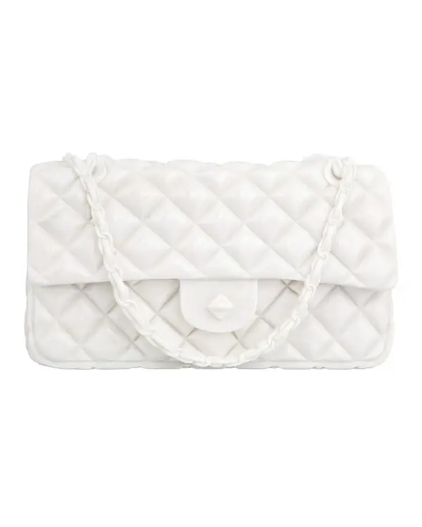 A sophisticated decorative piece that brings artistic flair to any space. Carved from solid white marble in the shape of a designer handbag, this sculpture adds a touch of luxury and whimsy to shelves, mantels, or console tables.