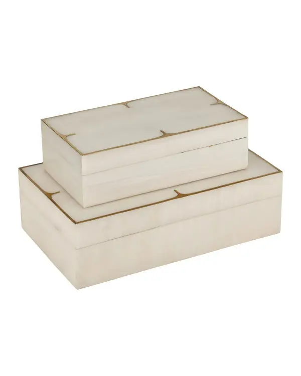 This sophisticated box set combines ivory composite with brushed brass trim for refined storage. The artisanal construction ensures each piece is unique, while the neutral palette works across traditional and contemporary interiors.
