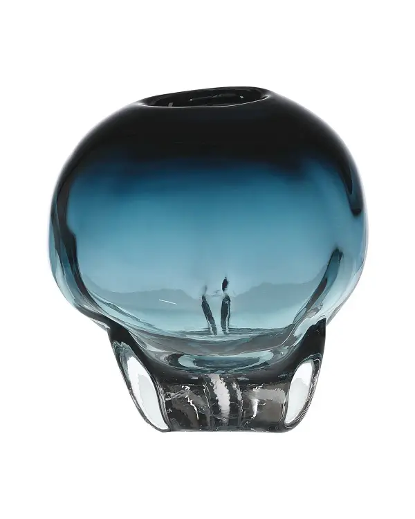 The Aubrey Orb Vase showcases masterful glass-blowing artistry with blue glass bubbling organically from a clear base. Its generous 11-inch scale and dramatic Art Nouveau silhouette make it a statement piece that elevates modern interiors with glamorous sophistication.