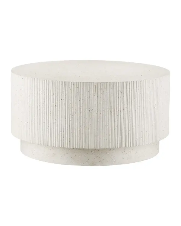 A striking cocktail table that combines contemporary design with exceptional durability. The ribbed terrazzo surface with metallic flecks creates visual interest while fiber-reinforced concrete construction ensures longevity in any setting.