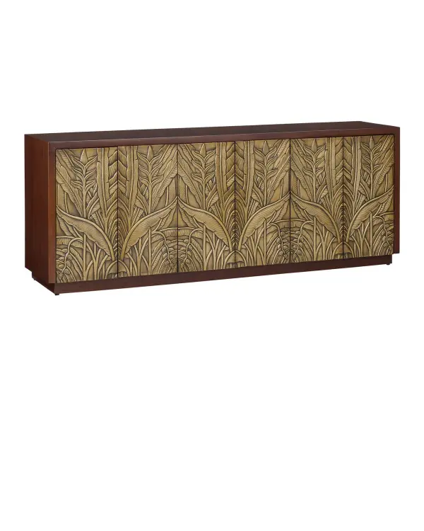 The Jardin Credenza showcases exceptional repoussage craftsmanship with hand-detailed leafy brass motifs against warm walnut wood. Its substantial 84-inch width provides generous storage while serving as a statement piece.
