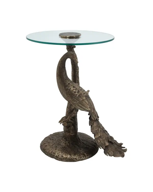 This cast aluminum accent table features an intricate peacock sculpture as its base, finished in warm antique gold with a clear glass top. The artistic design serves as both functional furniture and decorative statement piece.