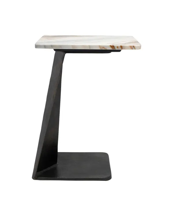 The Toth C Table brings architectural drama to compact spaces with its cast aluminum cantilever frame and luxurious Calacatta marble top. The brutalist-inspired design offers serious visual weight while maintaining a practical footprint for sofa-side or bedside use.
