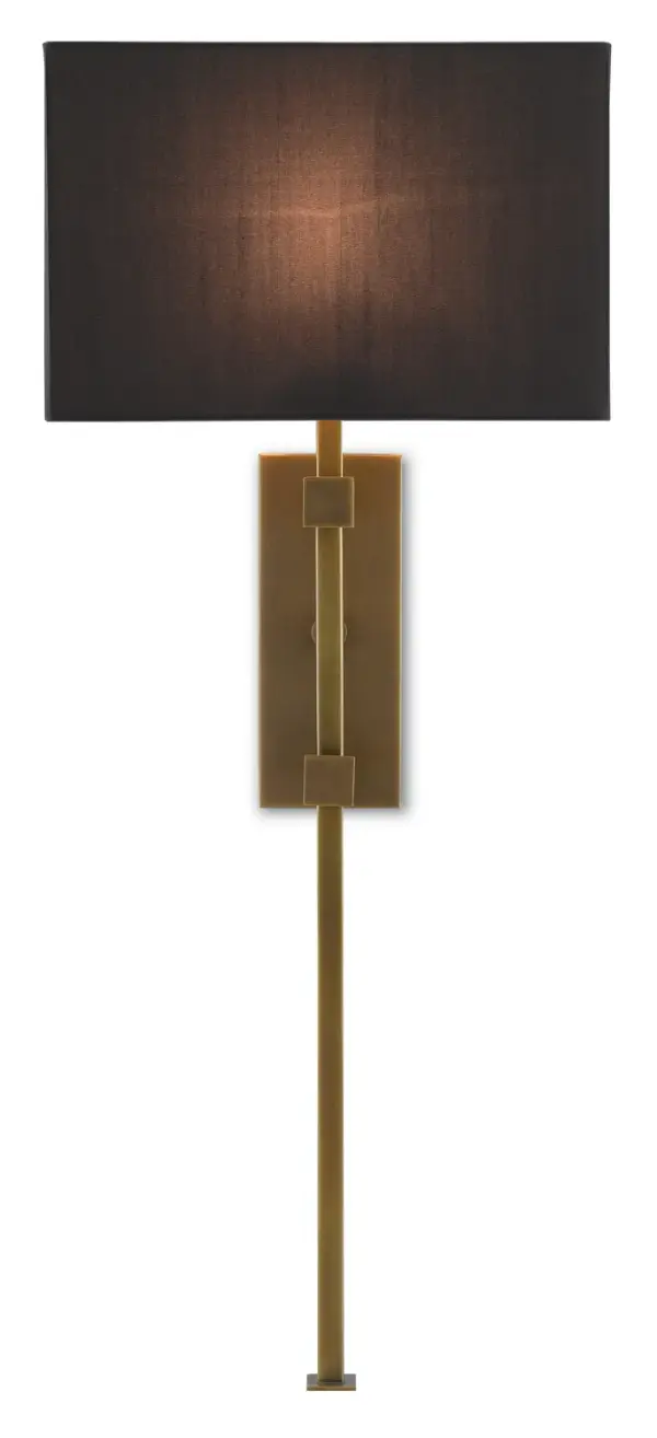 The Edmund Wall Sconce commands attention with its dramatic 36.75-inch height and bold geometric composition. The interplay of antique brass metalwork and black shantung shade creates a refined contrast perfect for modern and transitional interiors.
