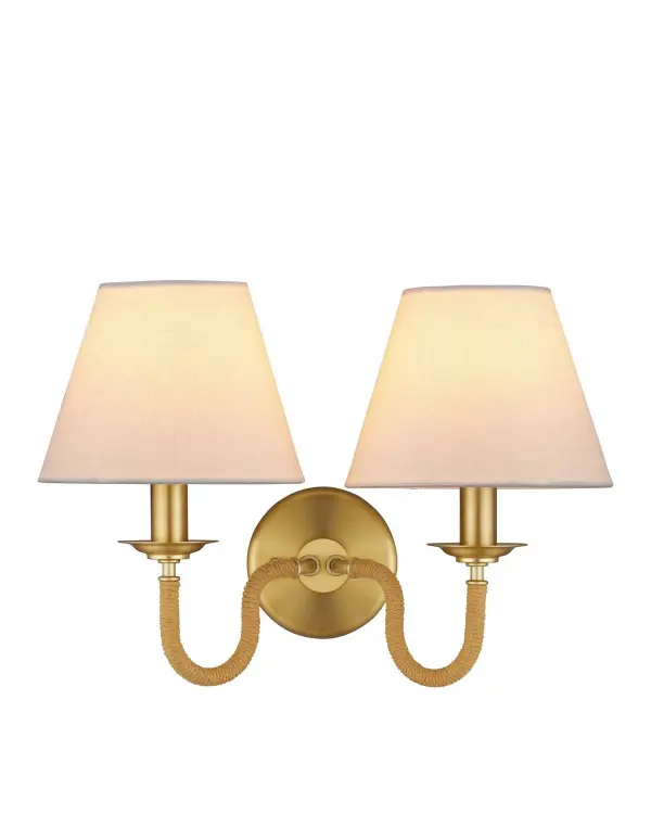 The Adala sconce blends traditional elegance with coastal texture through rope-wrapped arms and brushed brass finish. Its compact 16-inch width and soft linen shades make it ideal for flanking mirrors or creating ambient lighting in smaller spaces.